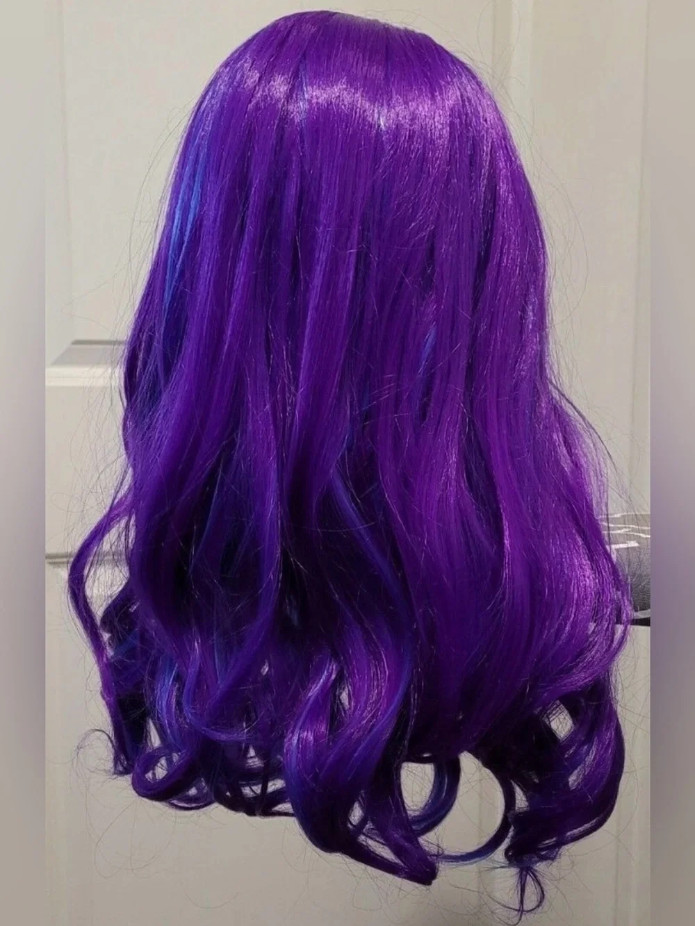 Purple synthetic long wig with blue highlights